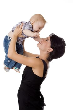 Beautiful happy mather with attractive baby boy on white. Portrait of  baby and his mother.