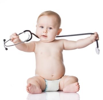 Sweet baby with stethoscope on a white background. Adorable baby boy on white