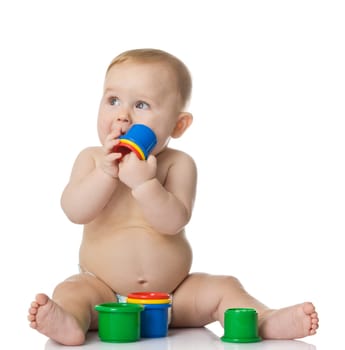 Baby playing with cup toys. Isolated on white background