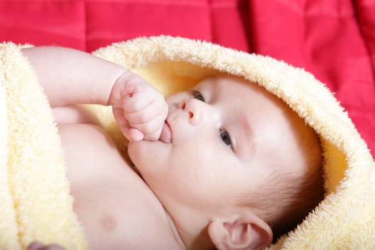 Newborn - close-up focus baby boy with yelow blanket