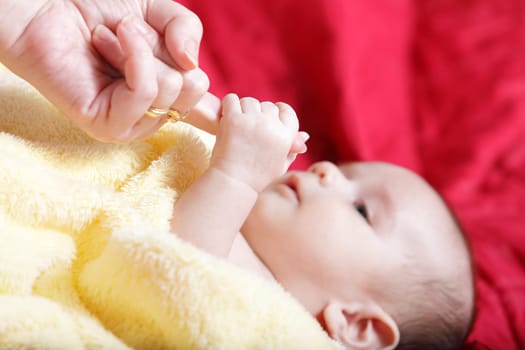 Newborn - first touches with mother hand
