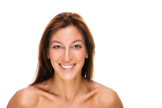 Portrait of a happy young woman against a white background