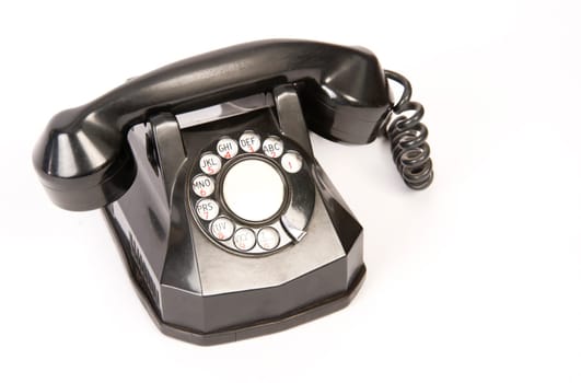 A Vintage Rotary Dial Telephone isolated on white