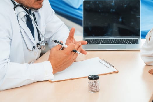 Doctor in professional uniform examining patient at hospital or medical clinic. Health care , medical and doctor staff service concept. Jivy