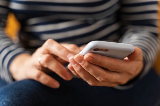 female hands deftly operating a smartphone, reflecting our universal dependence on digital communications.