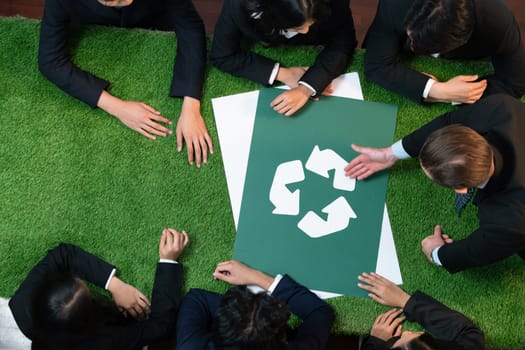 Top view panorama banner recycle icon on meeting table in office with business people planning eco business investment on waste management as recycle reduce reuse concept for clean ecosystem. Quaint