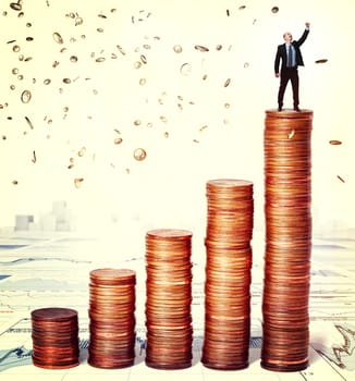 businessman on top of euro coin piles
