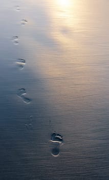 Footprints in wet sand