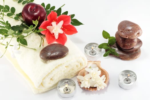 concept of spa whit stone fruit jasmine towel lily mint and candles