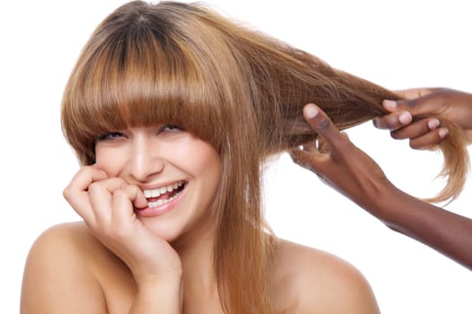 Beautiful happy woman getting her hair done