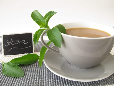 Coffee with milk with stevia and labeled board