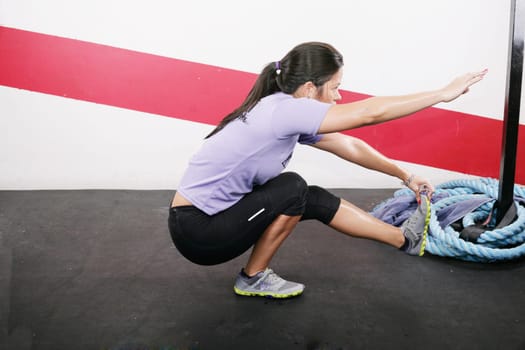 Young Woman Exercising on gym