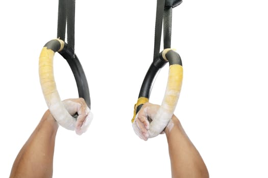 Athlete on the rings on a white background