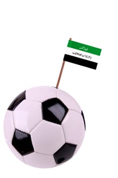 Soccer ball or football decorated with a small national flag on a tooth stick