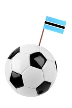 Soccer ball or football decorated with a small national flag of Botswana on a tooth stick
