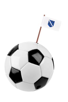 Soccer ball or football decorated with a small national flag of "Bosnia Herzogovina"" on a tooth stick"
