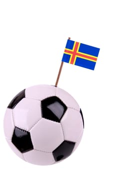 Soccer ball or football decorated with a small national flag on a tooth stick