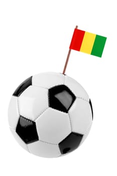 Soccer ball or football decorated with a small national flag of Guinea on a tooth stick