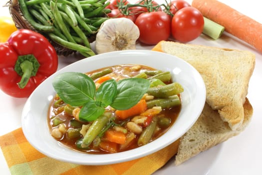 a bowl of minestrone and basil