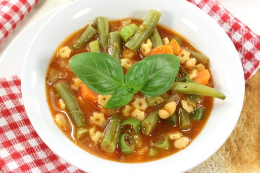 a bowl of minestrone and basil