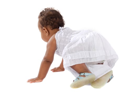 adorable baby learning to walk a over white background