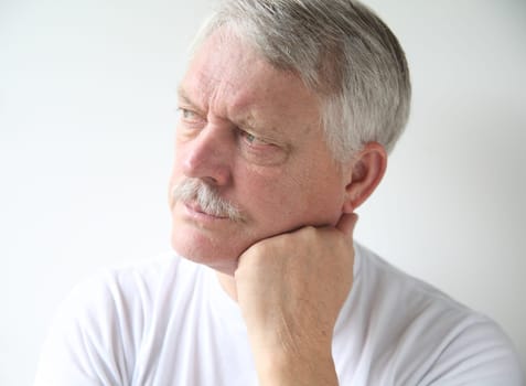 senior man with an irritated expression