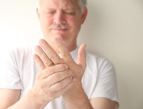 an older man has numbness and tingling in his hand