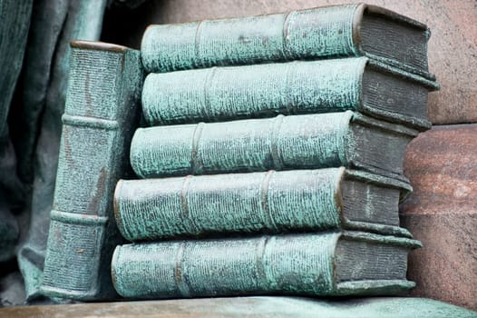 Bronze books as sculpture fragment. Taken in Helsinki, Finland on July 2012.