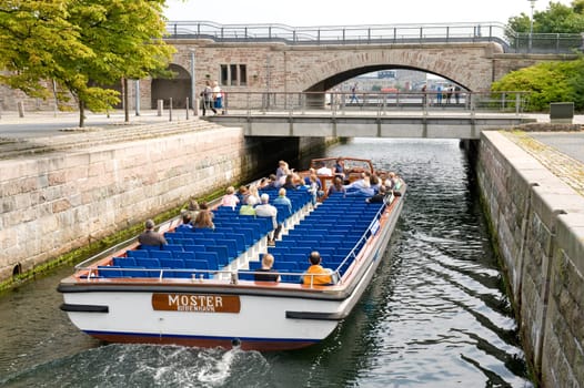 Group of tourists on an excursion boat in Copenhagen. Taken on June 2012