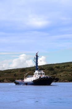 tug boat sailing on the river shannon at foynes in ireland