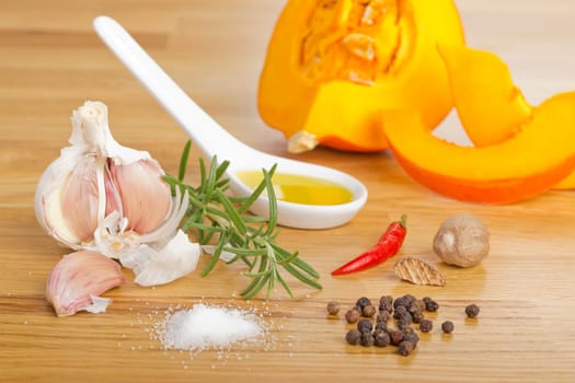 Spice Still Life with Pumpkin on Wooden Plate