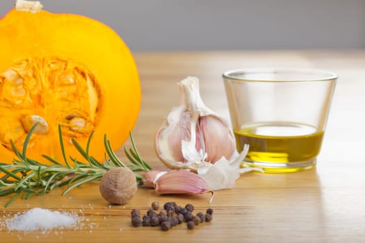 Spice Still Life with Pumpkin on Wooden Plate