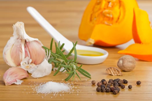Spice Still Life with Pumpkin on Wooden Plate