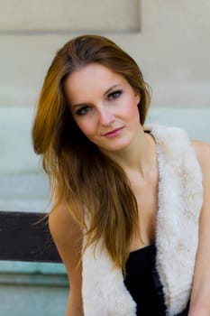 Young, beautiful woman in the city park