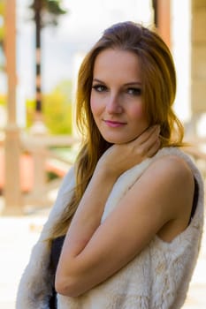 Young, beautiful woman in the city park