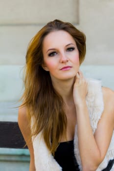 Young, beautiful woman in the city park