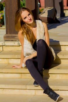 Young, beautiful woman in the city park