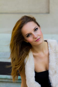 Young, beautiful woman in the city park