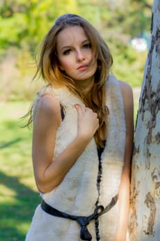 Young, beautiful woman in the city park