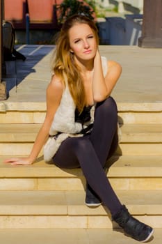 Young, beautiful woman in the city park
