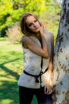Young, beautiful woman in the city park