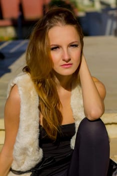 Young, beautiful woman in the city park