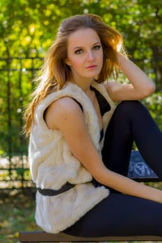 Young, beautiful woman in the city park