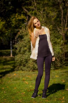Young, beautiful woman in the city park
