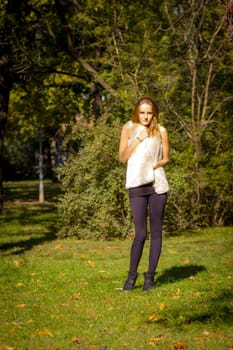 Young, beautiful woman in the city park