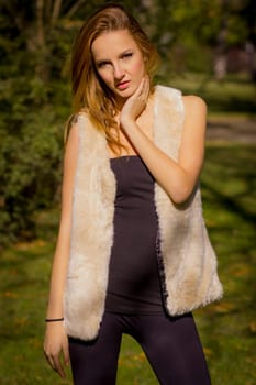 Young, beautiful woman in the city park