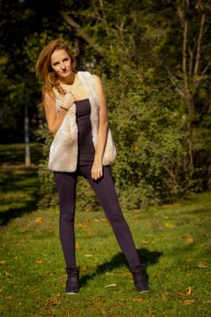 Young, beautiful woman in the city park
