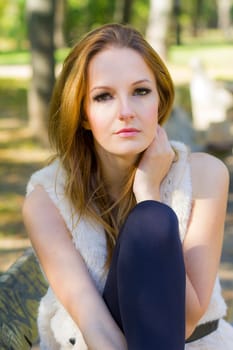 Young, beautiful woman in the city park