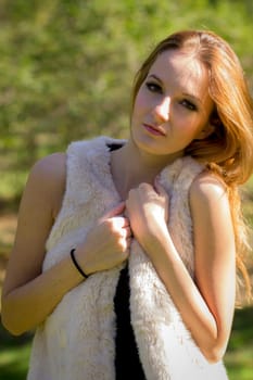 Young, beautiful woman in the city park