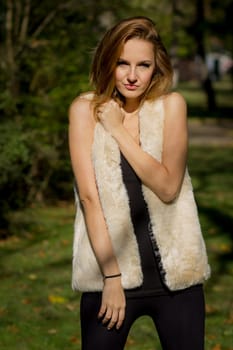 Young, beautiful woman in the city park